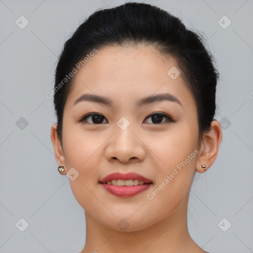 Joyful asian young-adult female with short  brown hair and brown eyes