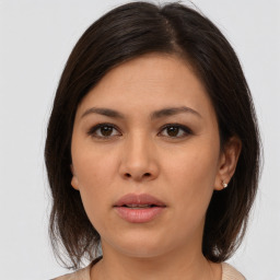 Neutral asian young-adult female with medium  brown hair and brown eyes