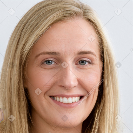 Joyful white young-adult female with long  brown hair and blue eyes