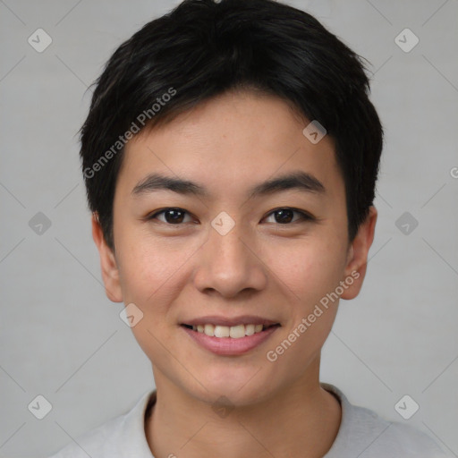 Joyful asian young-adult male with short  black hair and brown eyes