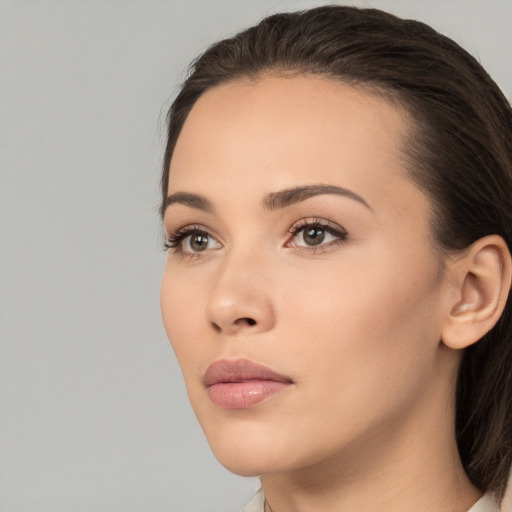 Neutral white young-adult female with medium  brown hair and brown eyes