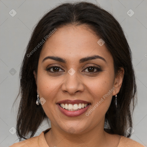 Joyful latino young-adult female with medium  brown hair and brown eyes