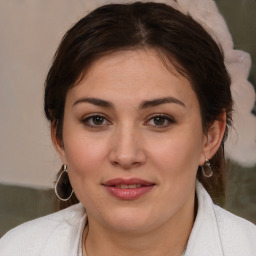 Joyful white young-adult female with medium  brown hair and brown eyes