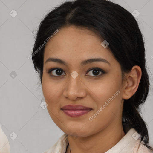 Joyful latino young-adult female with medium  brown hair and brown eyes