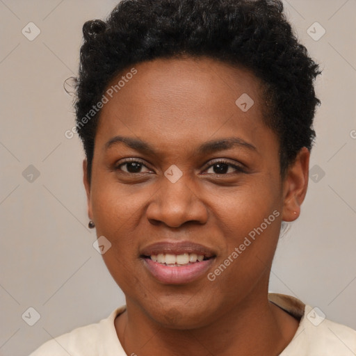 Joyful black young-adult female with short  brown hair and brown eyes