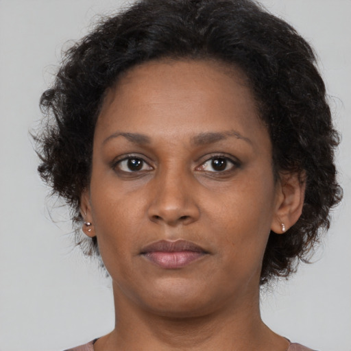 Neutral black young-adult female with short  brown hair and brown eyes
