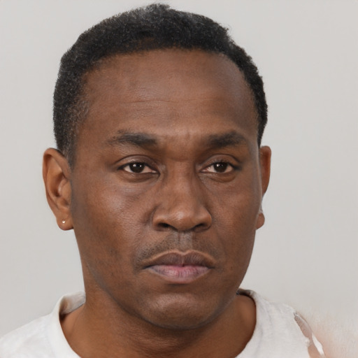 Neutral black young-adult male with short  brown hair and brown eyes