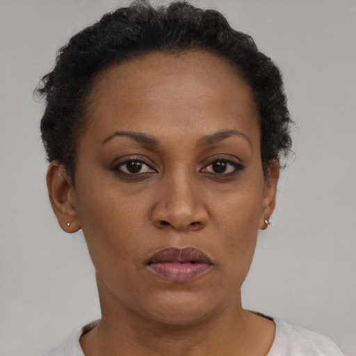 Neutral black young-adult female with short  brown hair and brown eyes