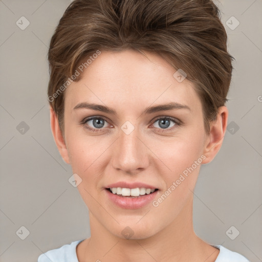 Joyful white young-adult female with short  brown hair and grey eyes