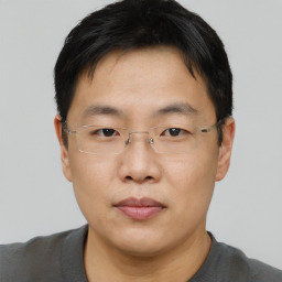 Neutral asian adult male with short  brown hair and brown eyes