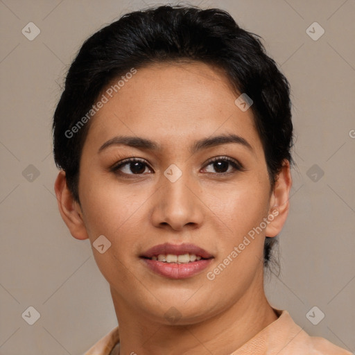 Joyful latino young-adult female with short  black hair and brown eyes