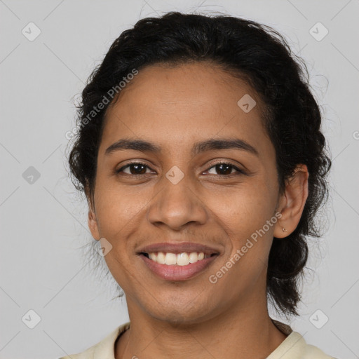 Joyful latino young-adult female with medium  brown hair and brown eyes