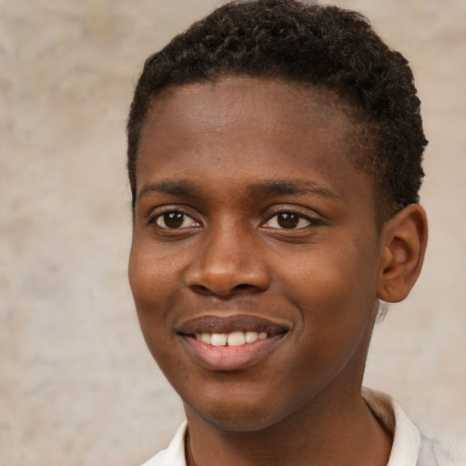 Joyful black young-adult male with short  brown hair and brown eyes