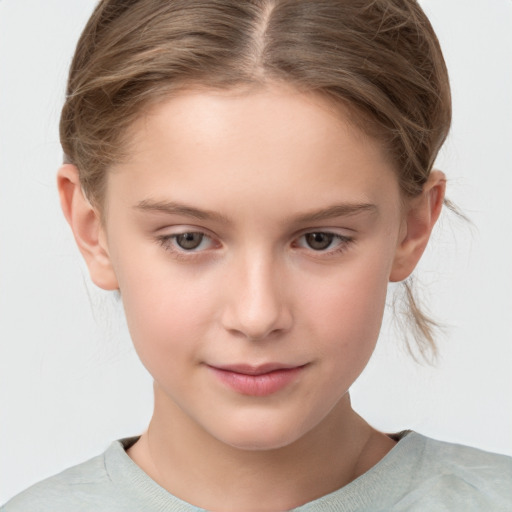 Joyful white child female with short  brown hair and grey eyes