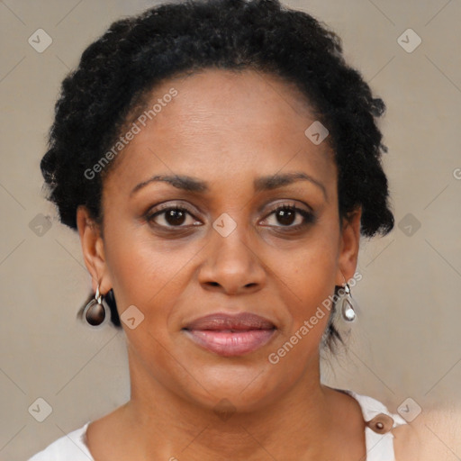 Joyful black adult female with short  brown hair and brown eyes