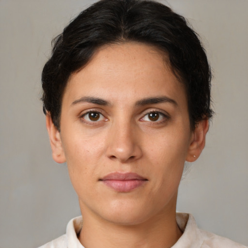 Joyful white young-adult female with short  brown hair and brown eyes