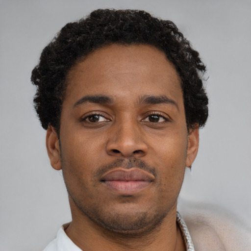 Neutral black young-adult male with short  brown hair and brown eyes