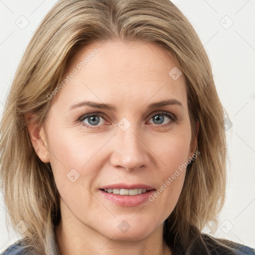 Joyful white young-adult female with long  brown hair and blue eyes