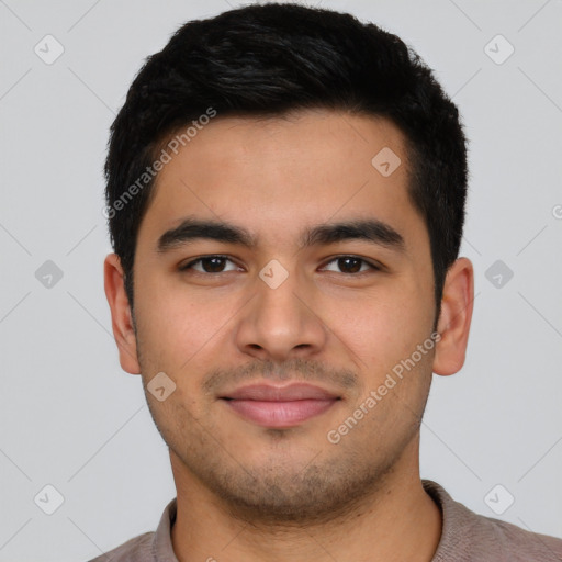 Joyful latino young-adult male with short  black hair and brown eyes