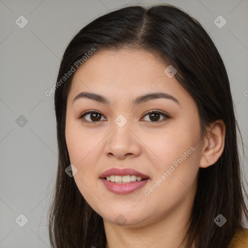 Joyful asian young-adult female with long  brown hair and brown eyes