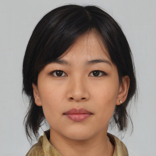 Neutral asian young-adult female with medium  brown hair and brown eyes