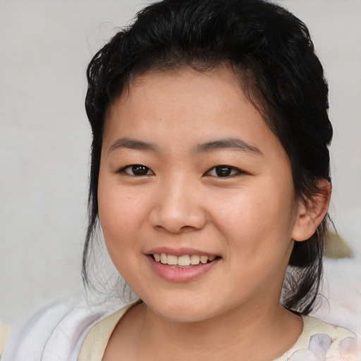 Joyful asian young-adult female with medium  brown hair and brown eyes