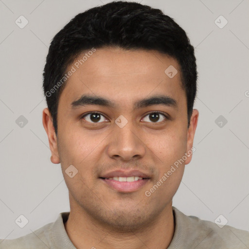 Joyful latino young-adult male with short  black hair and brown eyes