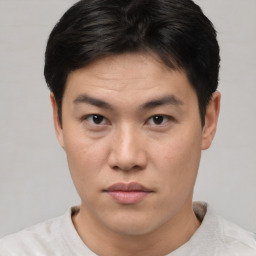 Neutral asian young-adult male with short  brown hair and brown eyes