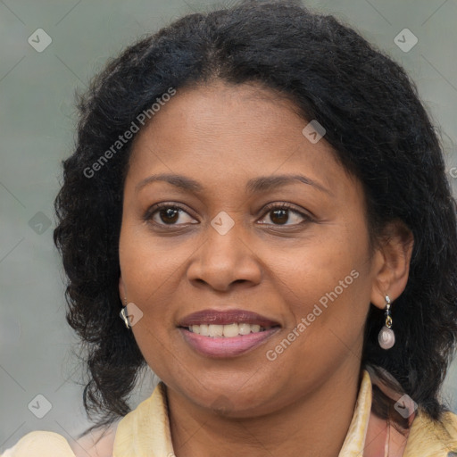 Joyful black adult female with medium  brown hair and brown eyes