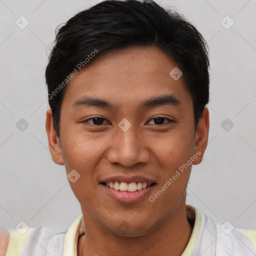 Joyful asian young-adult male with short  black hair and brown eyes