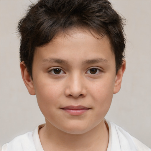 Joyful white child male with short  brown hair and brown eyes