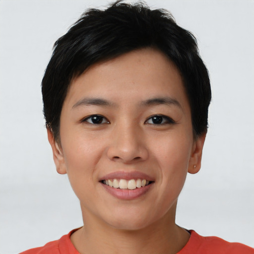 Joyful asian young-adult female with short  brown hair and brown eyes
