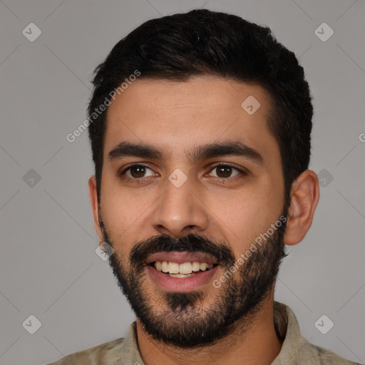 Joyful latino young-adult male with short  black hair and brown eyes