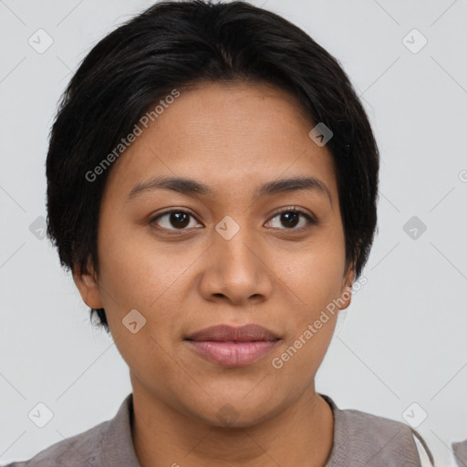 Joyful latino young-adult female with short  brown hair and brown eyes