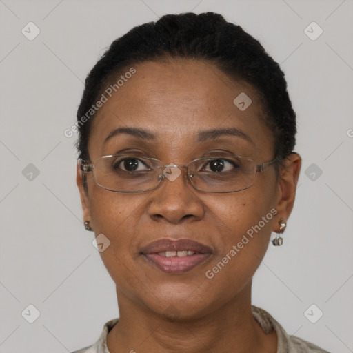 Joyful black adult female with short  brown hair and brown eyes