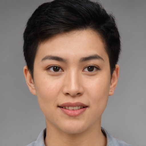 Joyful asian young-adult female with short  brown hair and brown eyes