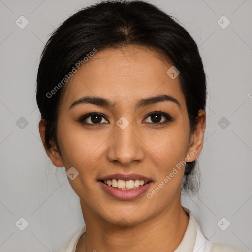 Joyful latino young-adult female with short  brown hair and brown eyes