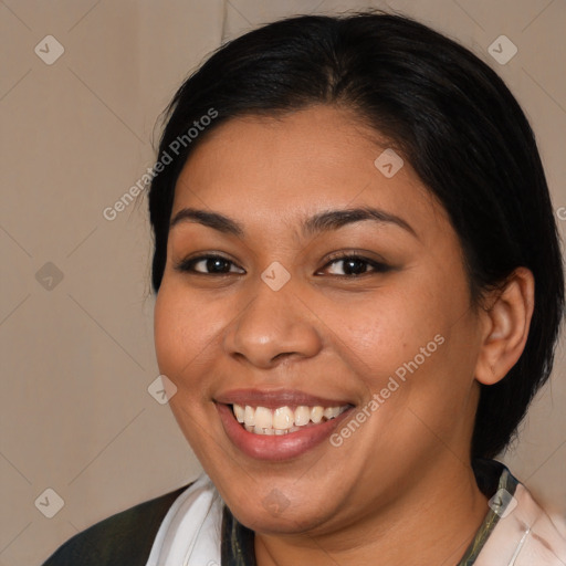 Joyful latino young-adult female with medium  brown hair and brown eyes