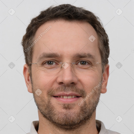 Joyful white adult male with short  brown hair and brown eyes