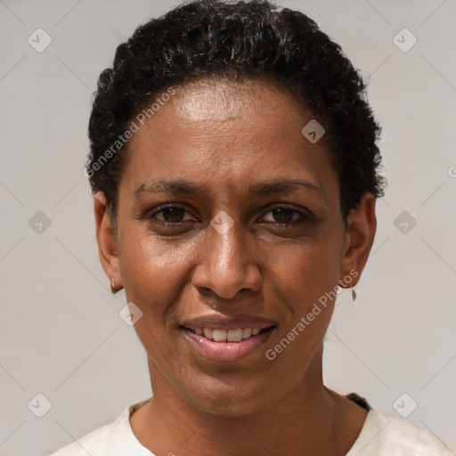 Joyful black adult female with short  black hair and brown eyes