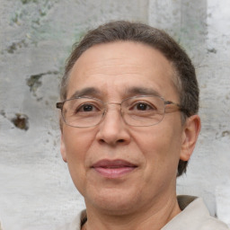 Joyful white middle-aged male with short  brown hair and brown eyes