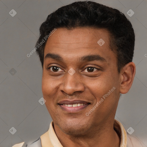 Joyful latino young-adult male with short  brown hair and brown eyes