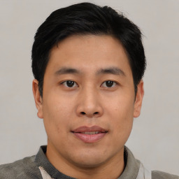 Neutral asian young-adult male with short  black hair and brown eyes