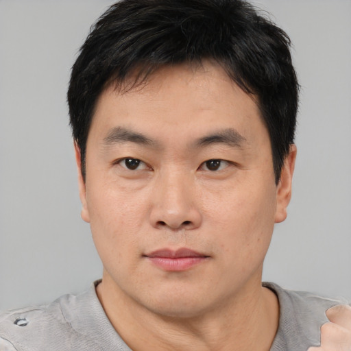 Neutral asian young-adult male with short  black hair and brown eyes