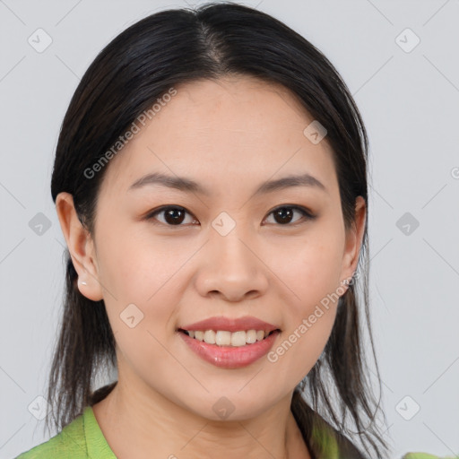 Joyful asian young-adult female with medium  brown hair and brown eyes