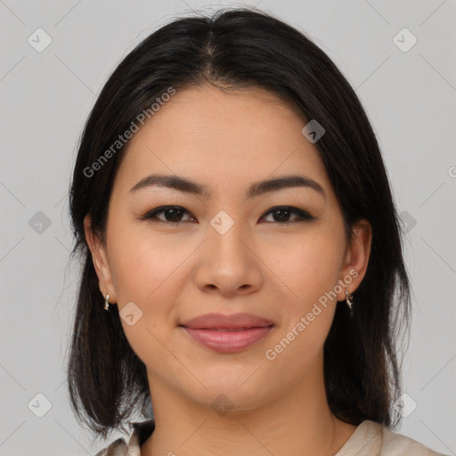 Joyful latino young-adult female with medium  brown hair and brown eyes