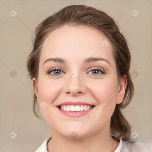 Joyful white young-adult female with medium  brown hair and green eyes