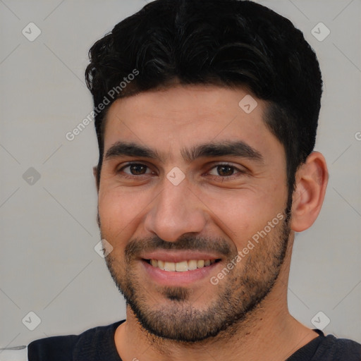 Joyful white young-adult male with short  black hair and brown eyes