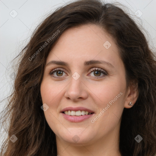 Joyful white young-adult female with long  brown hair and green eyes