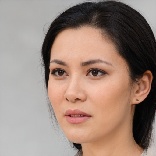 Neutral asian young-adult female with medium  brown hair and brown eyes
